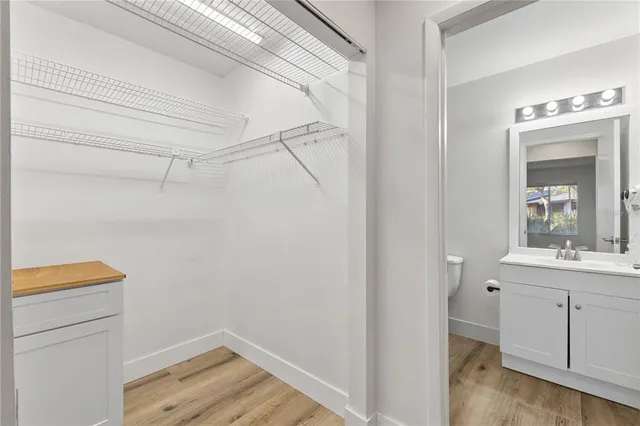 a room with a sink and a mirror