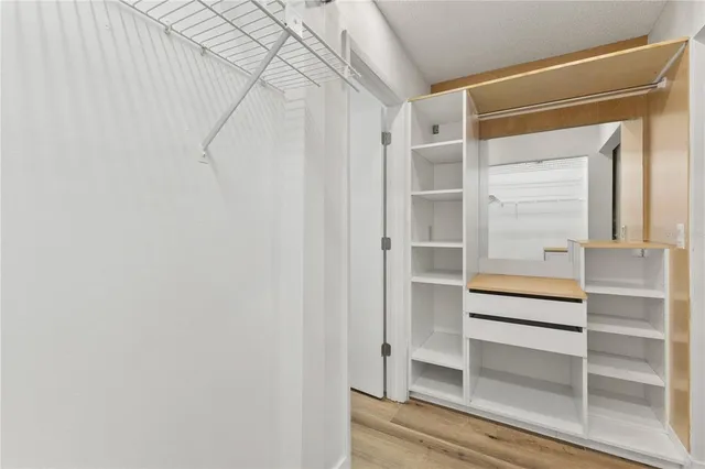 a view of an empty walk in closet