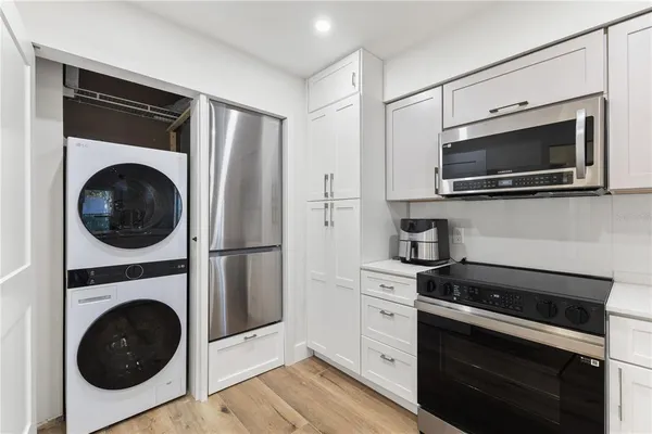 a kitchen with a stove and a microwave