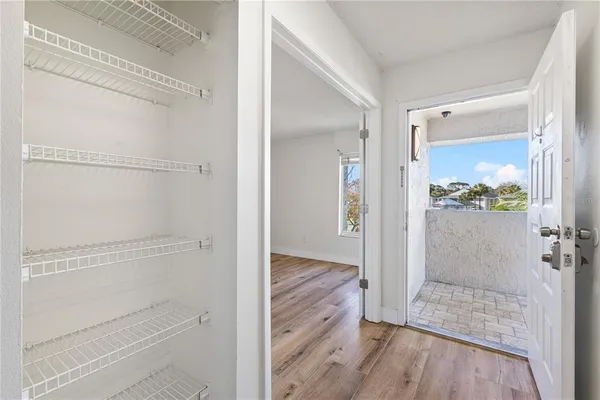 a view of bathroom with wooden floor