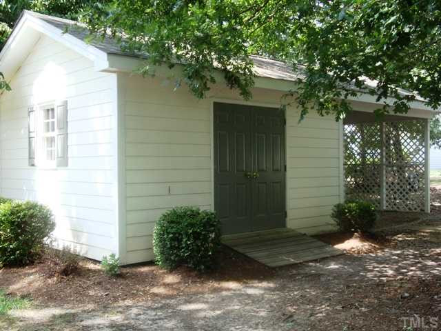 2845 Anfield Road Raleigh, NC 27606 - Photo 22 of 25 Detached Utility Shed with Overhang Perfect for Extra Storage Workshop