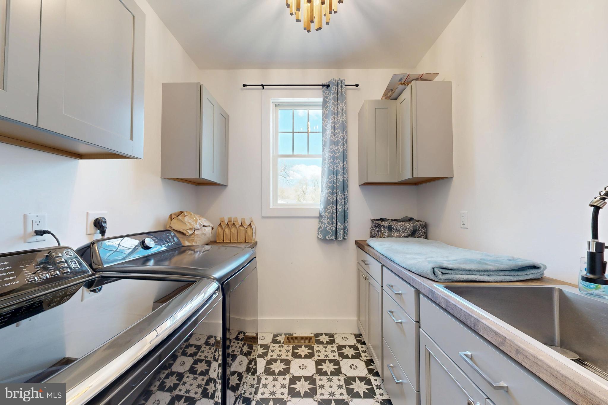 23730 Henry Road Ridgely, MD 21660 - Photo 20 of 28 a kitchen with granite countertop a sink stove and cabinets