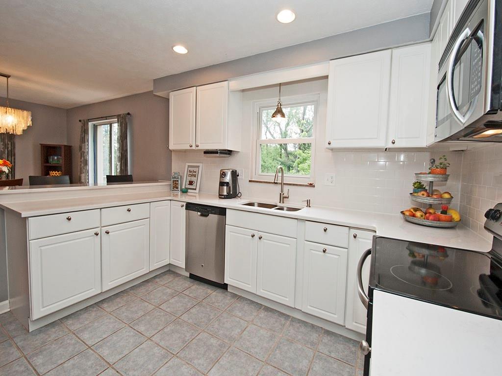 1350 Washington Road Mt. Lebanon, PA 15228 - Photo 8 of 18 Updated kitchen with gorgeous Granite counter tops with beautiful back splash, light and bright cabinets with lots of counter space, stainless steel appliances, recessed lighting, tile floor.