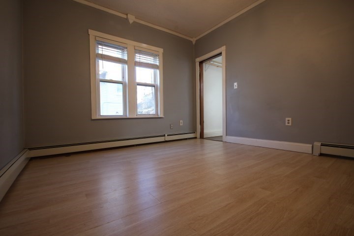 82 Green Hill Parkway Worcester, MA 01605 - Photo 14 of 42 an empty room with wooden floor and windows