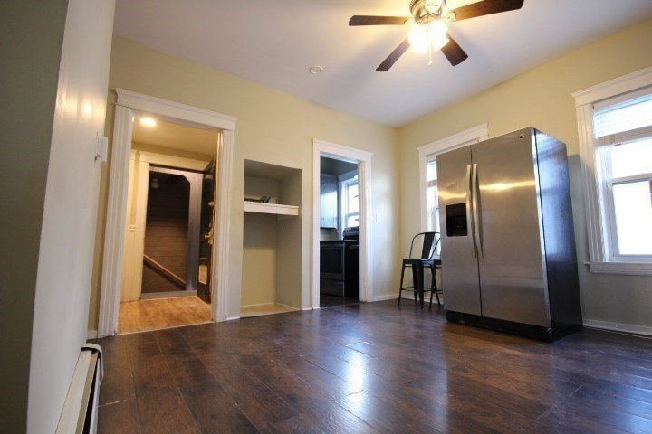 82 Green Hill Parkway Worcester, MA 01605 - Photo 17 of 42 a view of a livingroom with a chandelier fan and a wooden floor