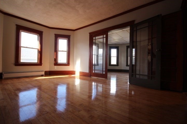 82 Green Hill Parkway Worcester, MA 01605 - Photo 25 of 42 a view of an empty room with wooden floor and a window