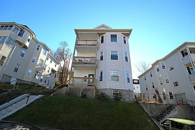 a view of a house with a yard