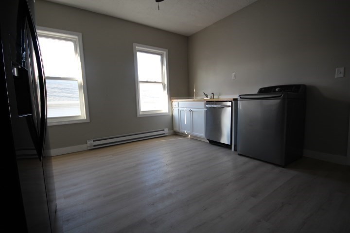 82 Green Hill Parkway Worcester, MA 01605 - Photo 32 of 42 an empty room with wooden floor and windows