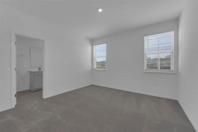 a view of an empty room and a window