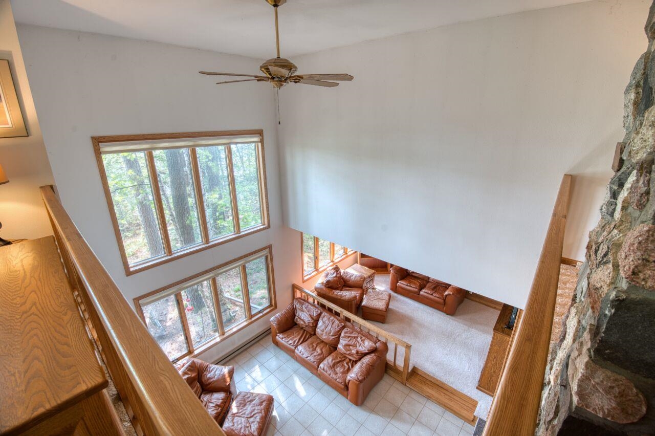 6312 Juniper Lane Gilbert, MN 55741 - Photo 18 of 50 Living room with a high ceiling and ceiling fan