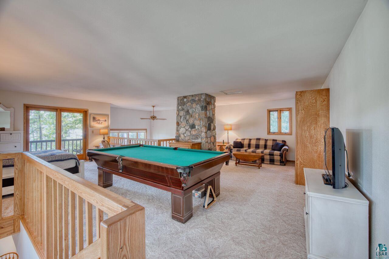 6312 Juniper Lane Gilbert, MN 55741 - Photo 21 of 50 Recreation room featuring light colored carpet, ceiling fan, and pool table