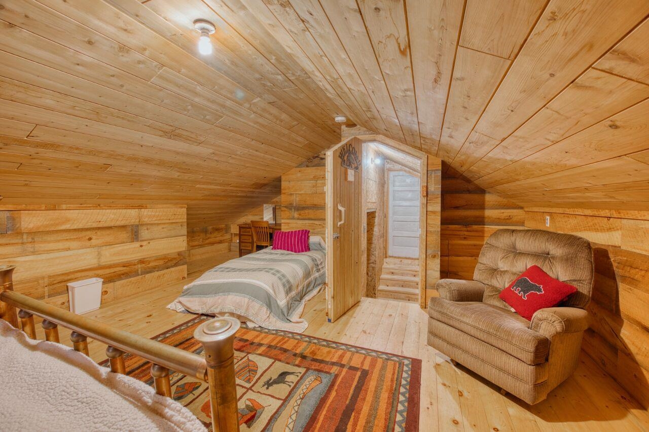 6312 Juniper Lane Gilbert, MN 55741 - Photo 31 of 50 Bedroom featuring lofted ceiling, wood-type flooring, and wood ceiling