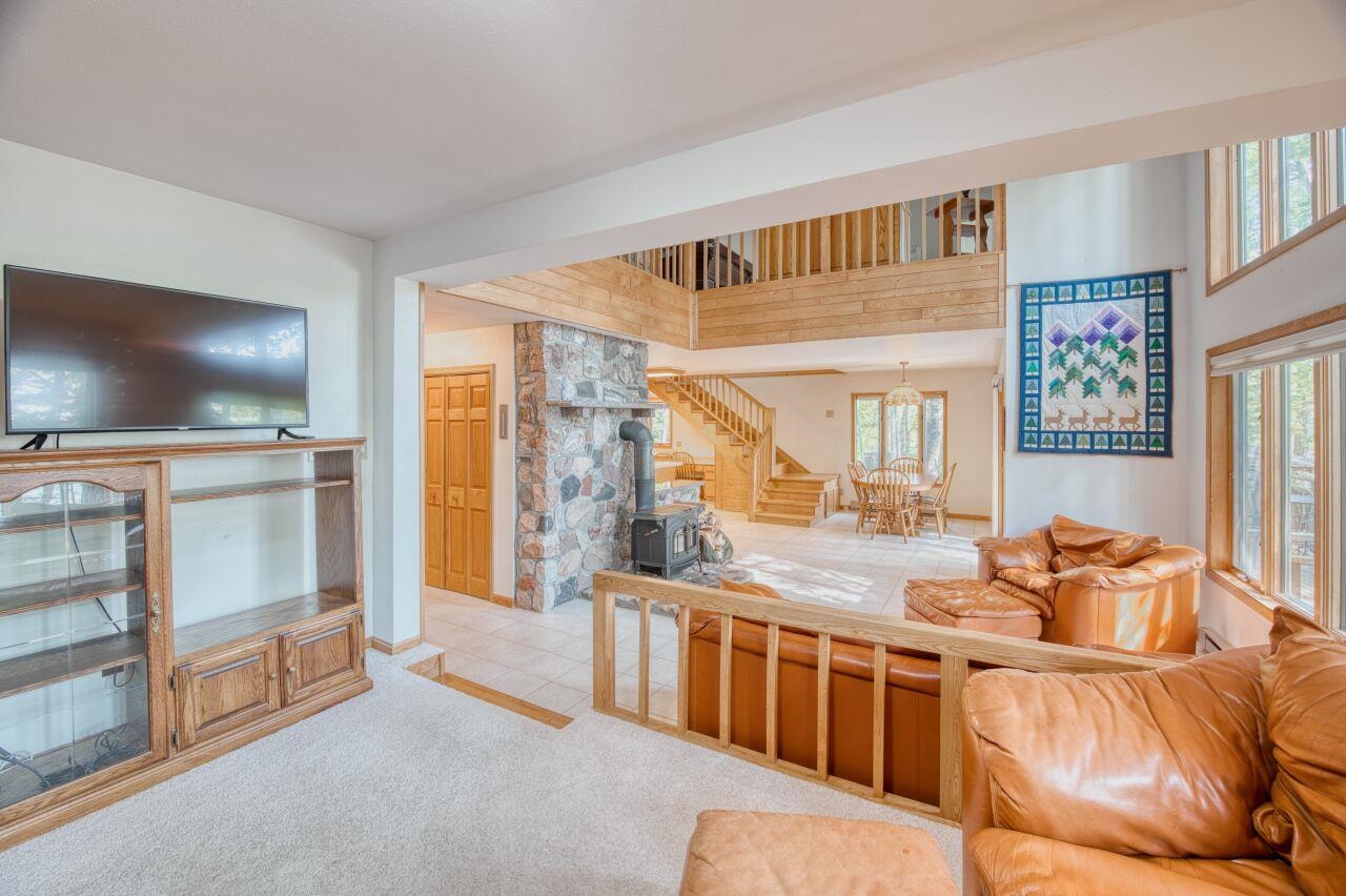 6312 Juniper Lane Gilbert, MN 55741 - Photo 5 of 50 Carpeted living room with a chandelier