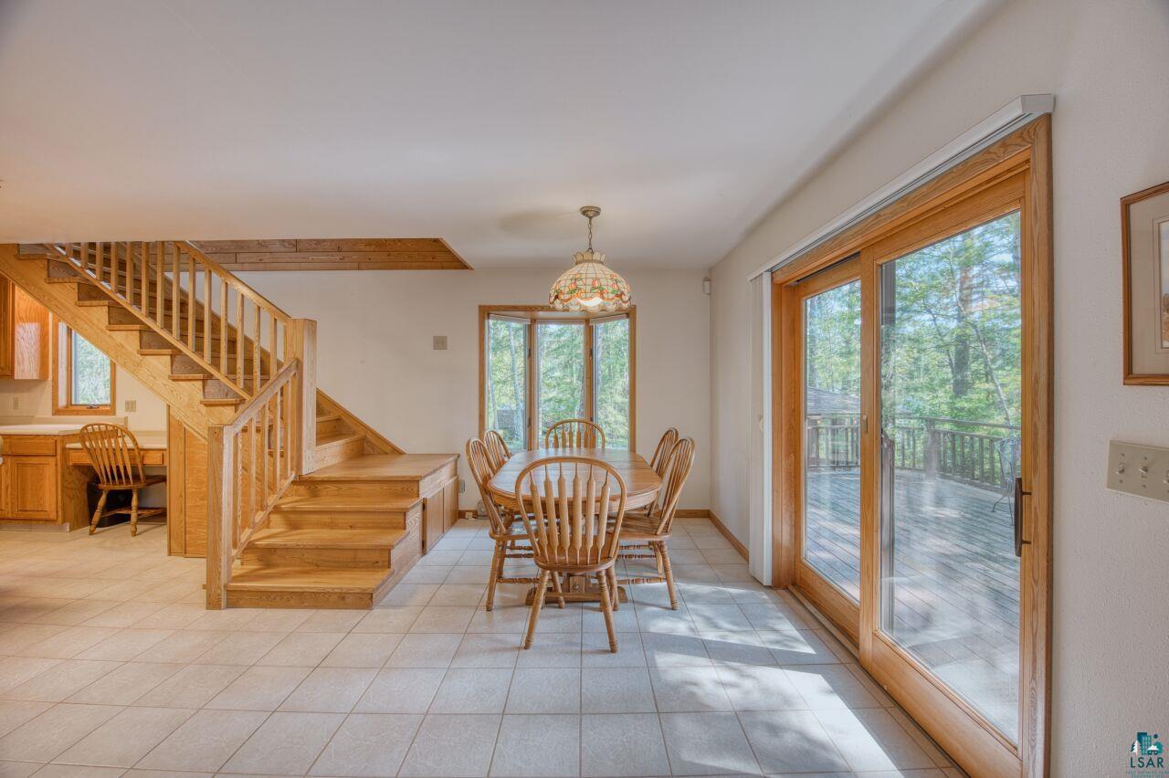 6312 Juniper Lane Gilbert, MN 55741 - Photo 6 of 50 Tiled dining space featuring a chandelier