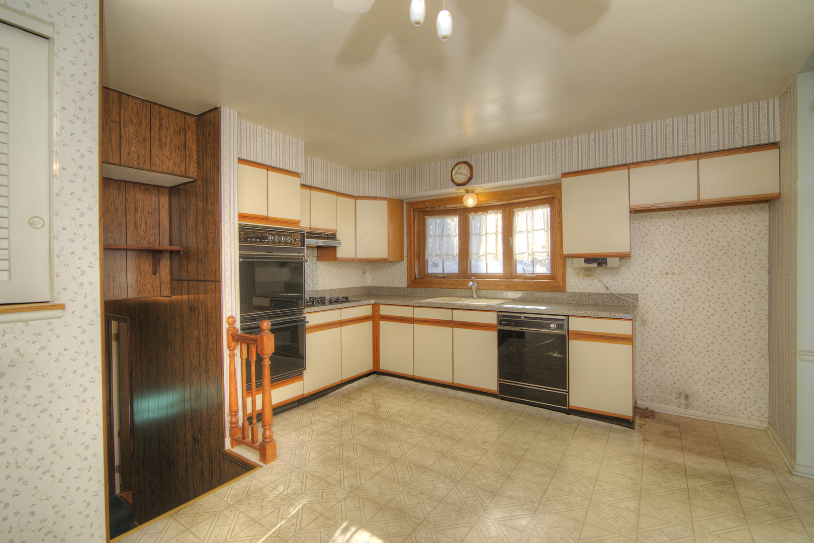 81 Ambleside Road Des Plaines, IL 60016 - Photo 11 of 24 a large kitchen with stainless steel appliances granite countertop a refrigerator and a sink