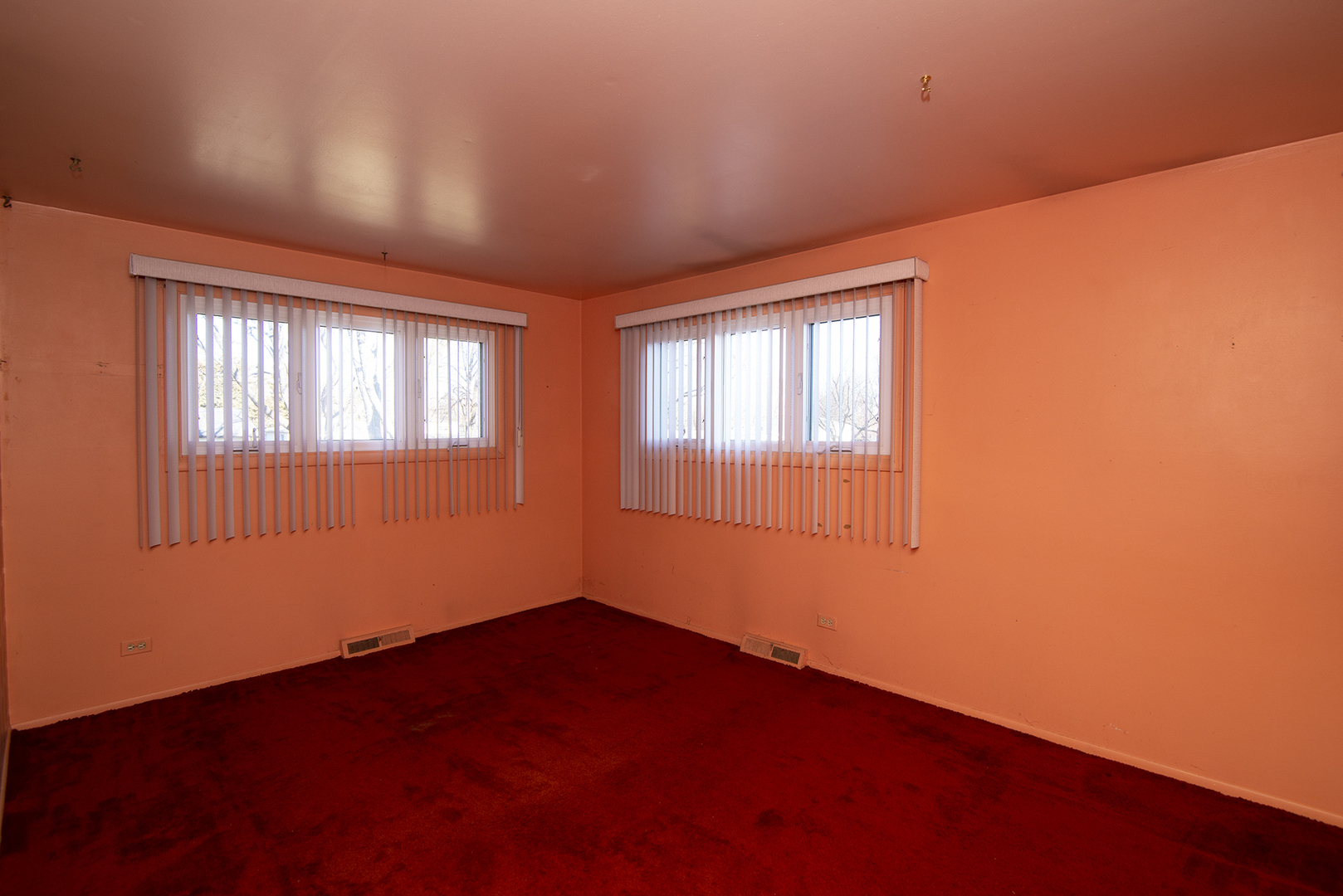 81 Ambleside Road Des Plaines, IL 60016 - Photo 18 of 24 a view of empty room with wooden floor and fan