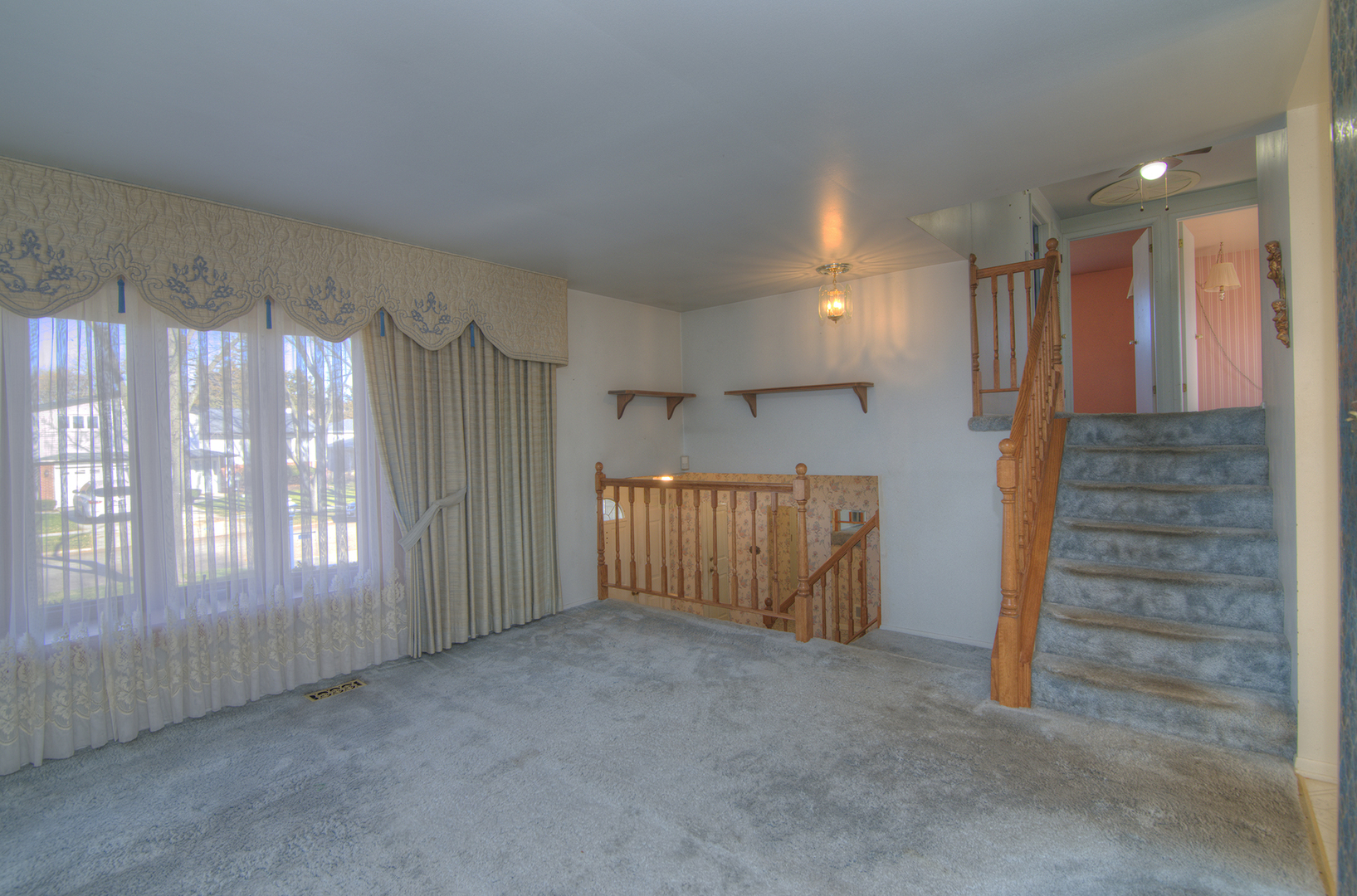 81 Ambleside Road Des Plaines, IL 60016 - Photo 4 of 24 a view of an empty room with a window