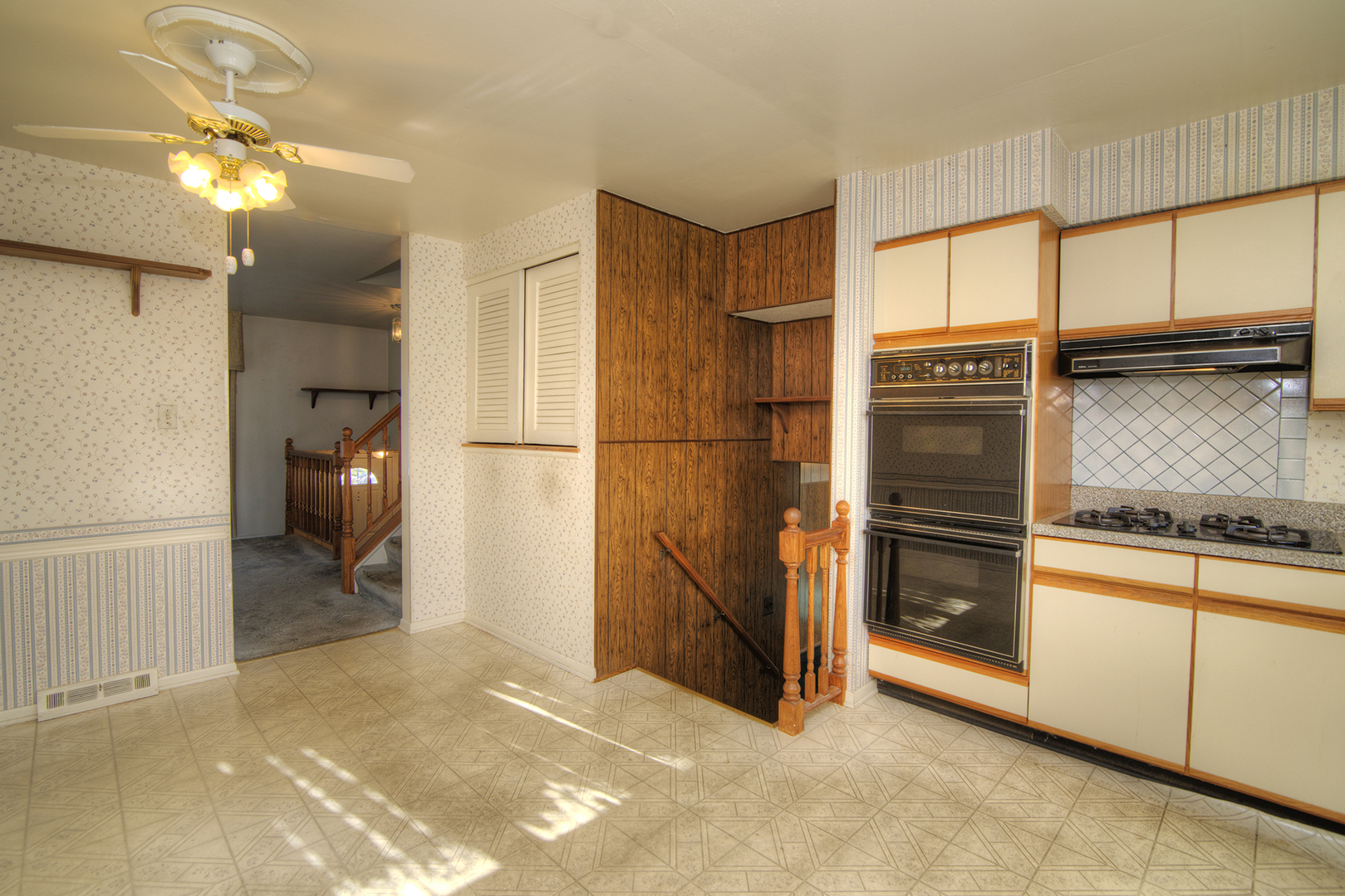 81 Ambleside Road Des Plaines, IL 60016 - Photo 10 of 24 a kitchen with stainless steel appliances granite countertop a refrigerator and a stove