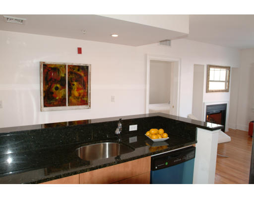 2025 Commonwealth Avenue, Unit 2 Boston, MA 02135 - Photo 4 of 11 a kitchen with a sink and cabinets