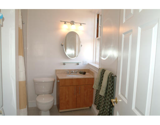 2025 Commonwealth Avenue, Unit 2 Boston, MA 02135 - Photo 10 of 11 a bathroom with a sink mirror vanity and toilet