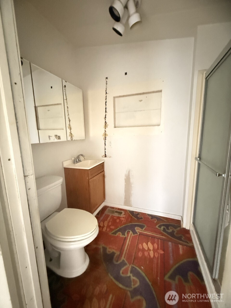 14003 70th Street East Sumner, WA 98390 - Photo 18 of 20 a bathroom with a toilet and a shower