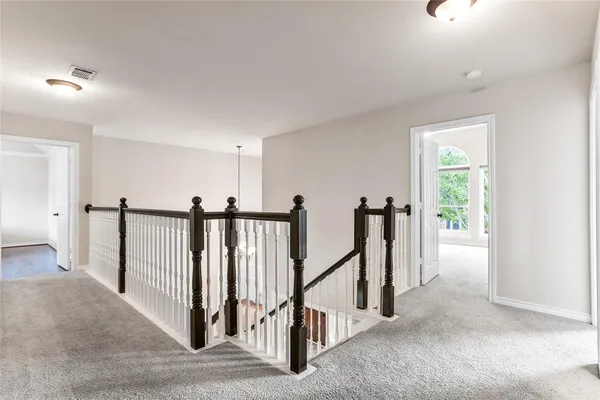 a view of a hallway with windows
