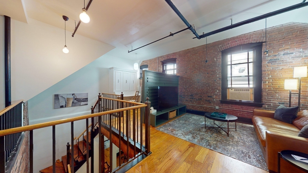 19 Stanhope Street, Unit 1B Boston, MA 02116 - Photo 13 of 20 a view of entryway and hall with wooden floor