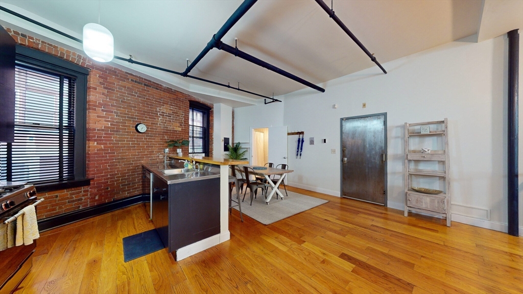 19 Stanhope Street, Unit 1B Boston, MA 02116 - Photo 9 of 20 a view of a livingroom with furniture and a window