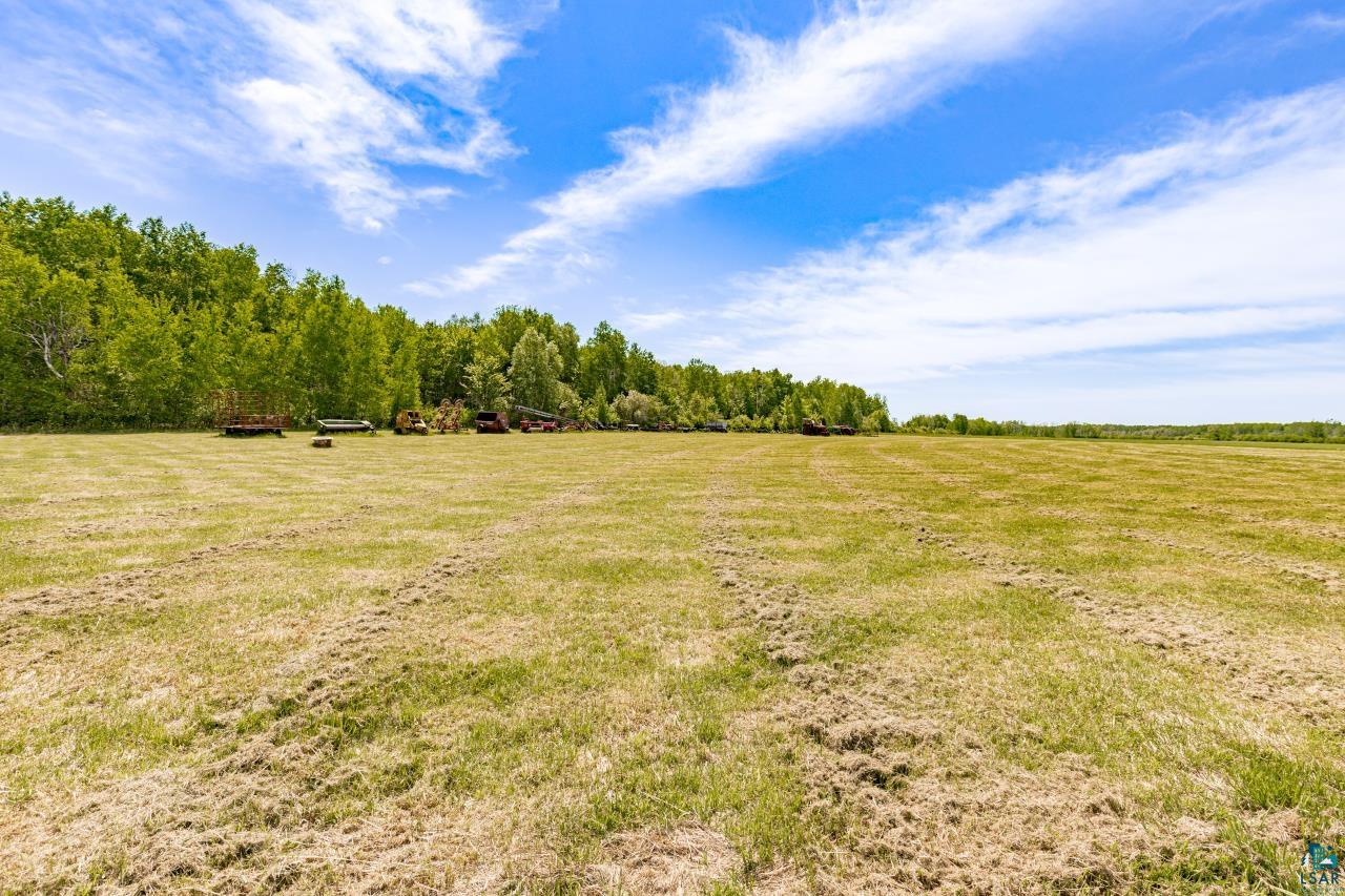 6606 Metso Road Kettle River, MN 55757 - Photo 62 of 84 Expansive open field with green and golden grasses
