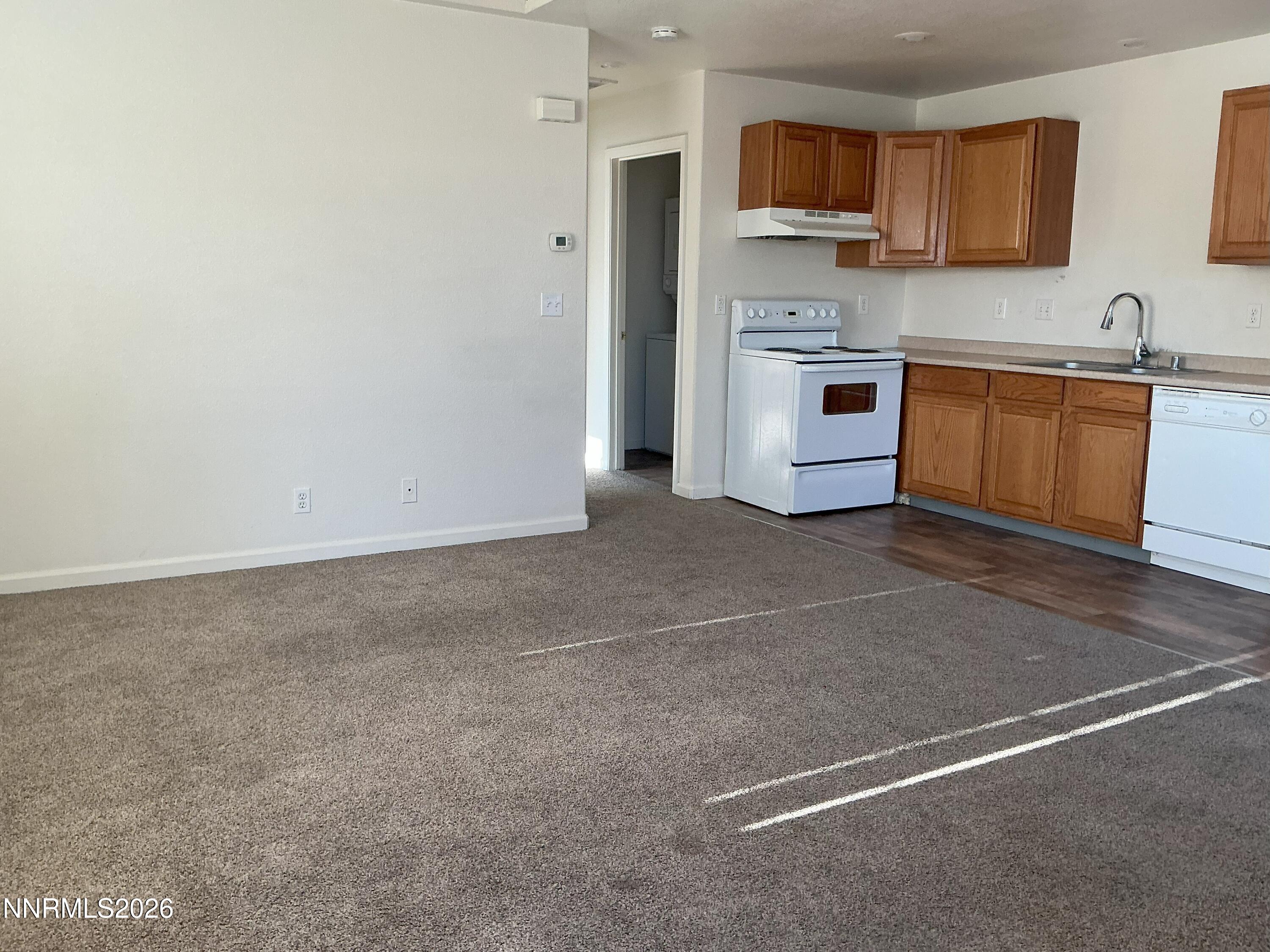330 Stewart Street Reno, NV 89502 - Photo 14 of 21 a view of a kitchen with a sink a refrigerator and window