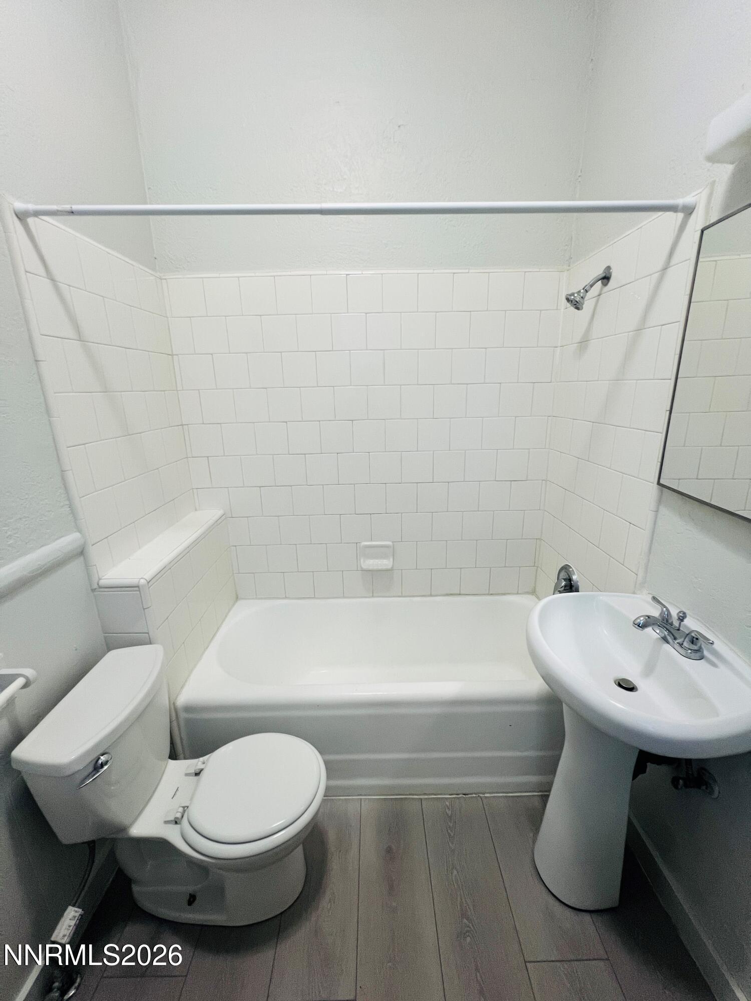 330 Stewart Street Reno, NV 89502 - Photo 7 of 21 a white toilet sitting next to a bath tub