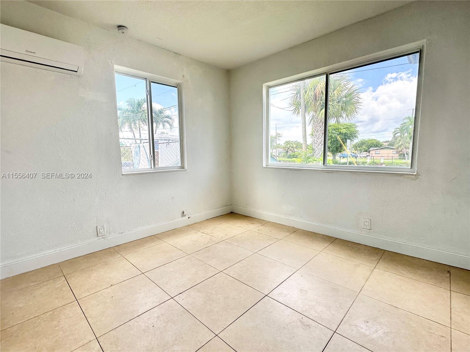 3730 S Avenue South, Unit 1 Riviera Beach, FL 33404 - Photo 6 of 12 a view of an empty room with a window