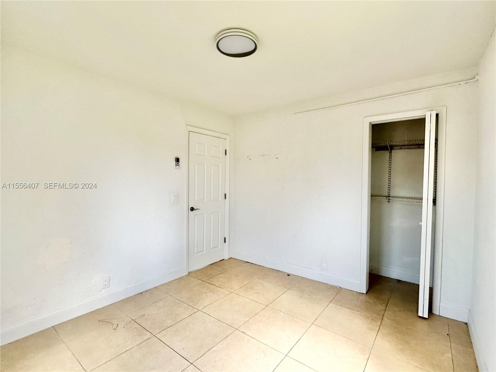 3730 S Avenue South, Unit 1 Riviera Beach, FL 33404 - Photo 8 of 12 a view of a room with rack on the wall