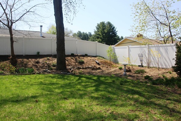 19 Cherry Road Framingham, MA 01701 - Photo 21 of 23 a backyard of a house with table and chairs