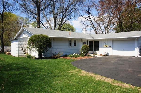19 Cherry Road Framingham, MA 01701 - Photo 23 of 23 a front view of a house with a garden and trees