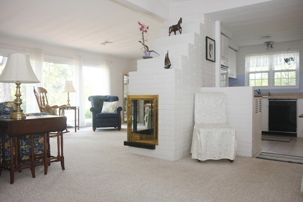 19 Cherry Road Framingham, MA 01701 - Photo 6 of 23 a living room with furniture and a fireplace