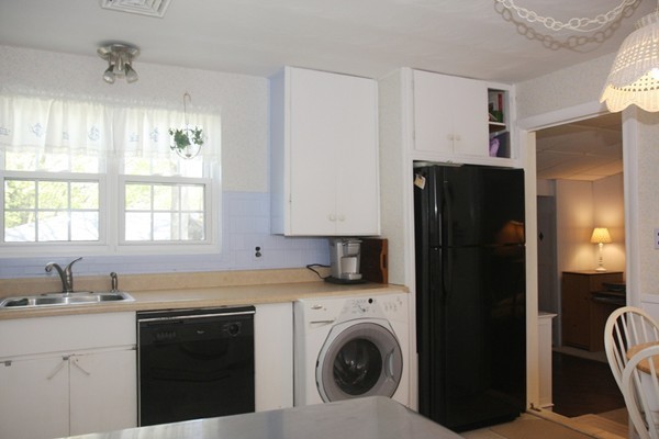 19 Cherry Road Framingham, MA 01701 - Photo 8 of 23 a kitchen with a refrigerator and sink