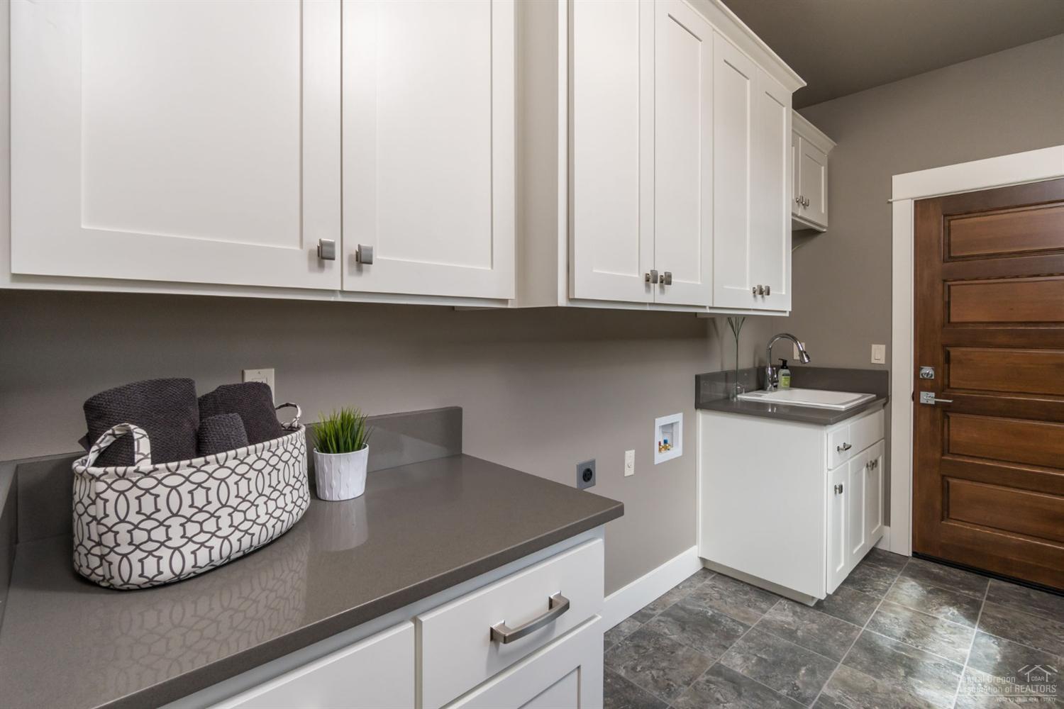 19307 Alianna Loop Bend, OR 97702 - Photo 17 of 21 Large Laundry Room with Built-in Cabinet