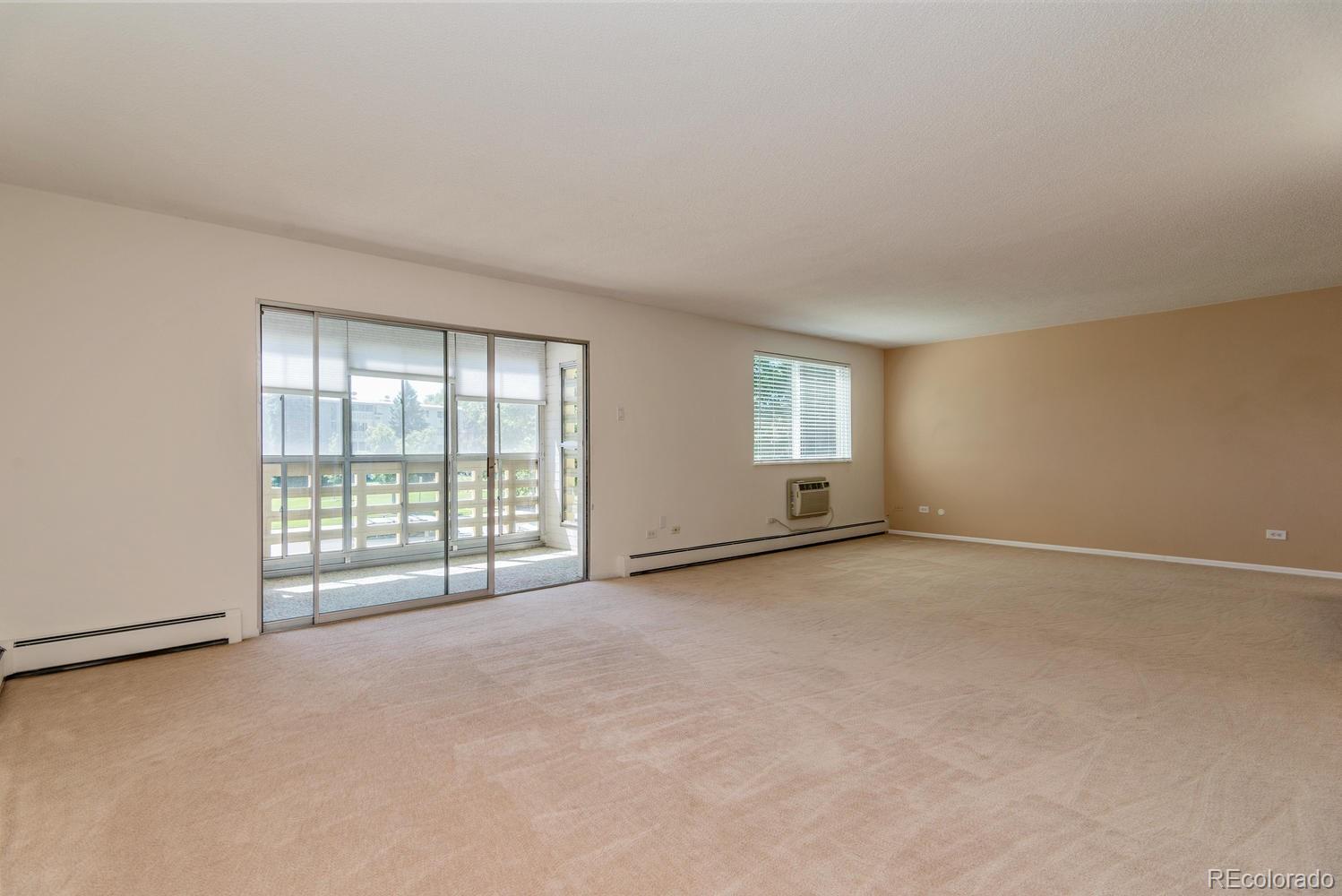 9155 Center Avenue, Unit 9B Denver, CO 80247 - Photo 6 of 35 an empty room with windows