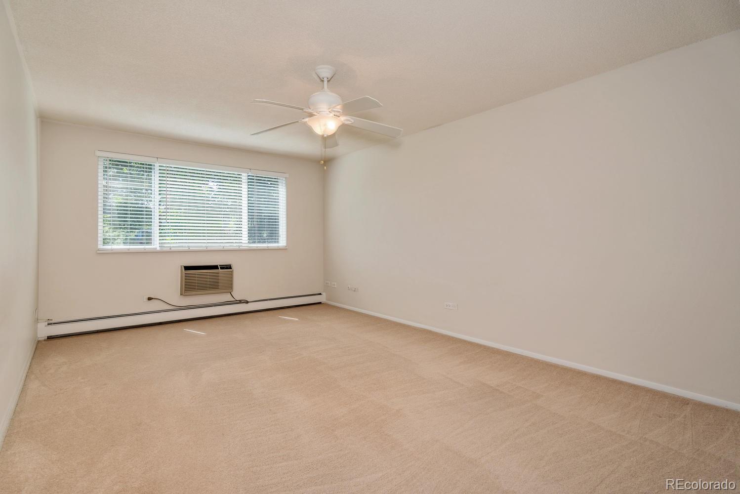 9155 Center Avenue, Unit 9B Denver, CO 80247 - Photo 8 of 35 an empty room with a window