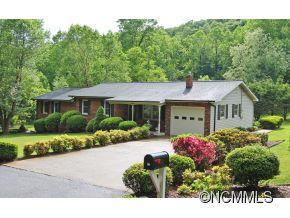 265 Hideaway Creek Road Clyde, NC 28721 - Photo 1 of 20 a front view of a house with a yard