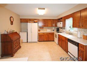 265 Hideaway Creek Road Clyde, NC 28721 - Photo 11 of 20 a kitchen with a sink stove and refrigerator