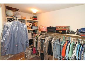 265 Hideaway Creek Road Clyde, NC 28721 - Photo 15 of 20 a view of walk in closet with clothes and shoes