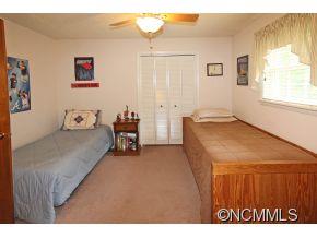 265 Hideaway Creek Road Clyde, NC 28721 - Photo 17 of 20 a bedroom with a bed and a window