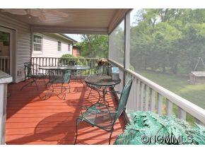 265 Hideaway Creek Road Clyde, NC 28721 - Photo 5 of 20 a balcony with table and chairs
