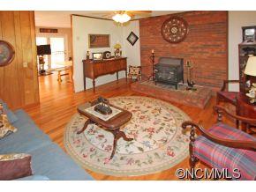 265 Hideaway Creek Road Clyde, NC 28721 - Photo 8 of 20 a living room with furniture and a table