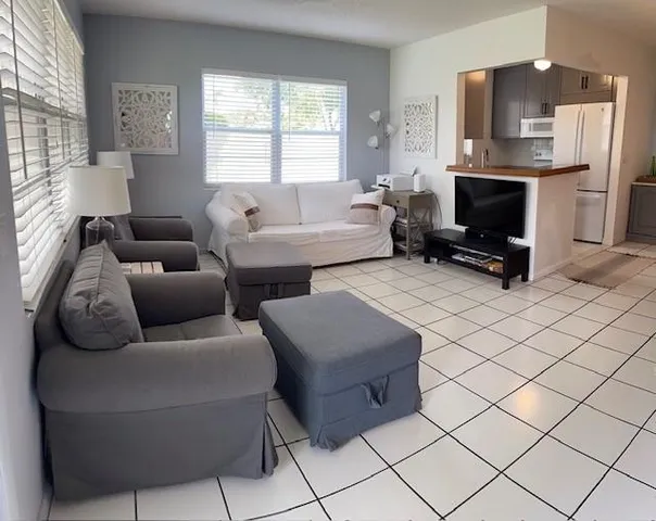 a dining room filled with furniture and window