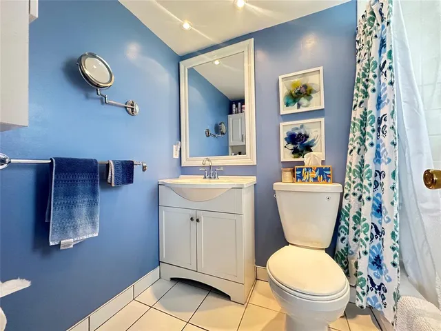 a bathroom with a toilet a sink and bathtub