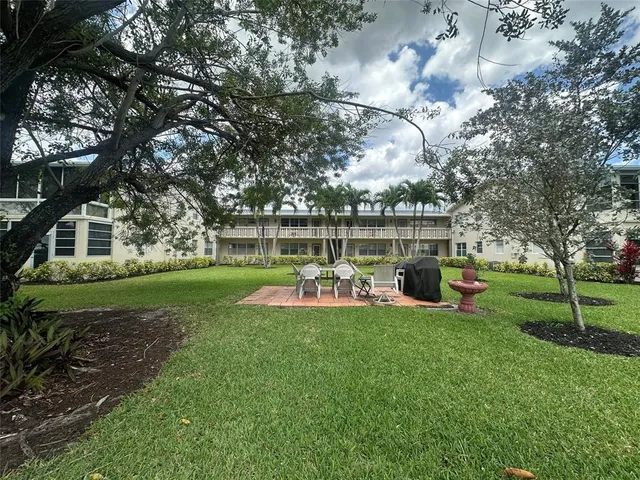 an aerial view of a house with a swimming pool
