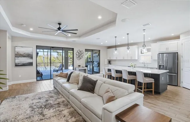 a bedroom with a bed couch tv and a window